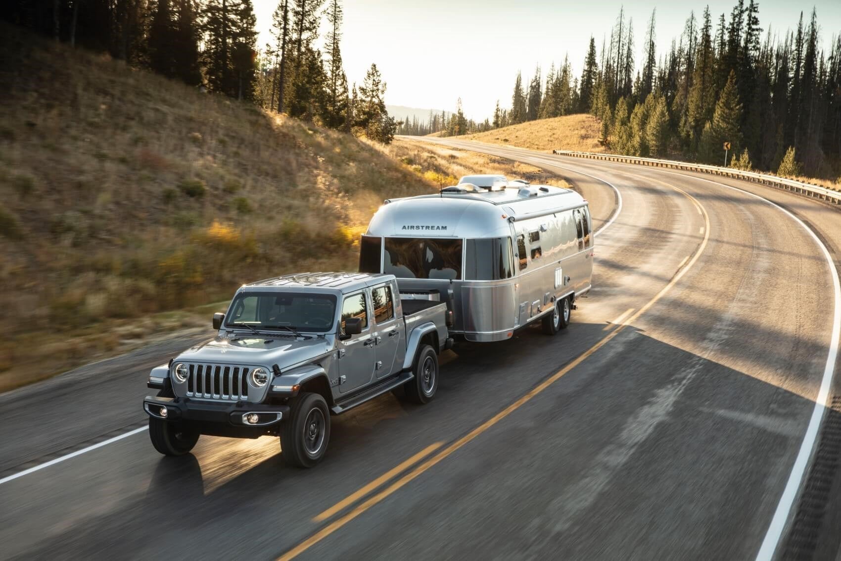 Jeep Gladiator climbing over off-road trail